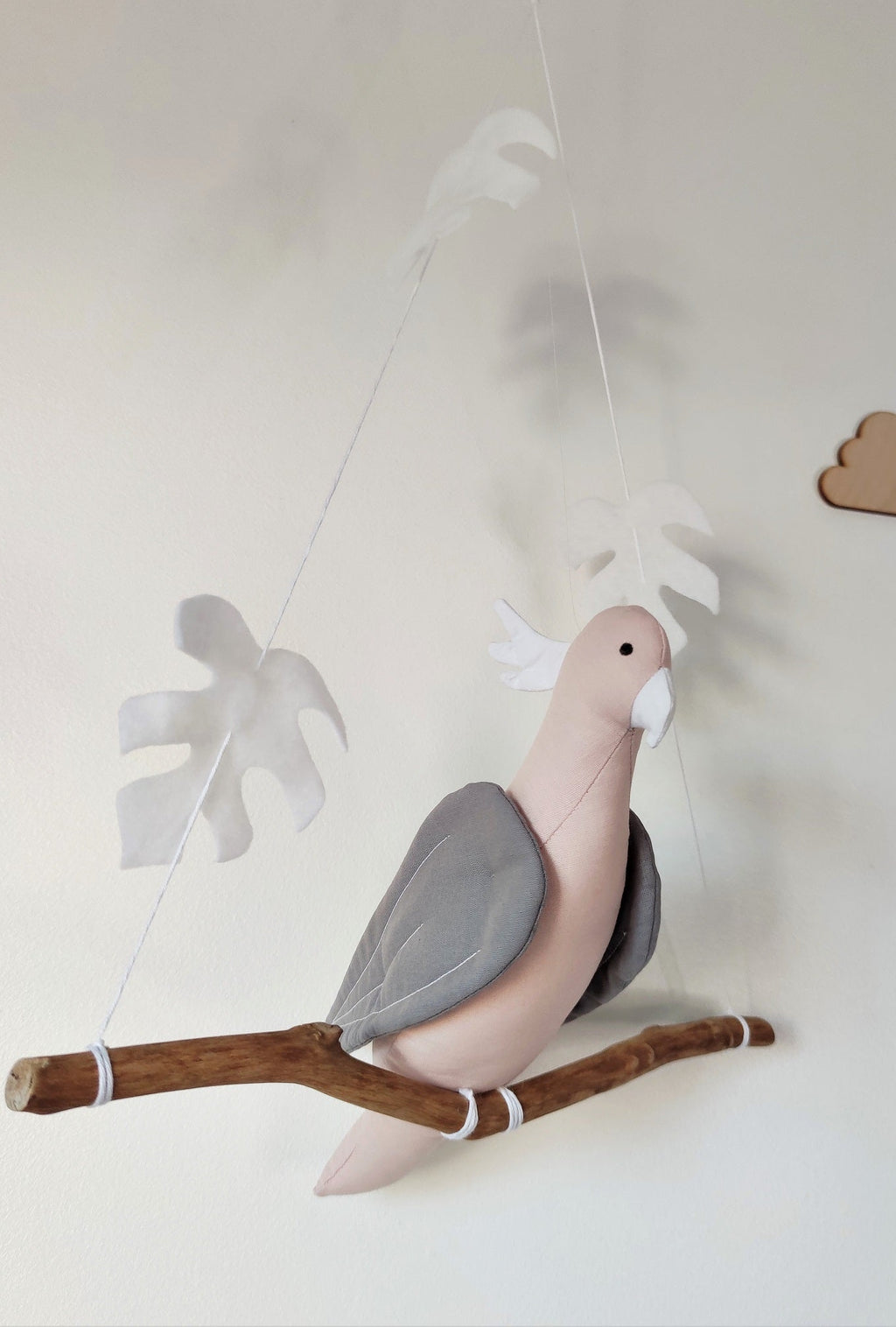 Pink Albin Cockatoo parrot on its branch
