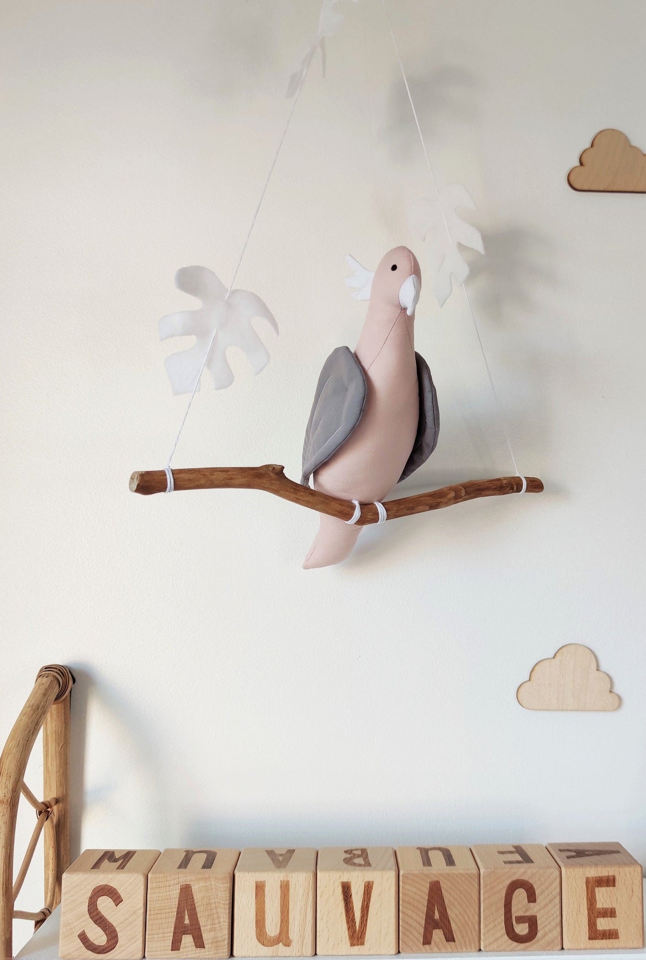 Pink Albin Cockatoo parrot on its branch